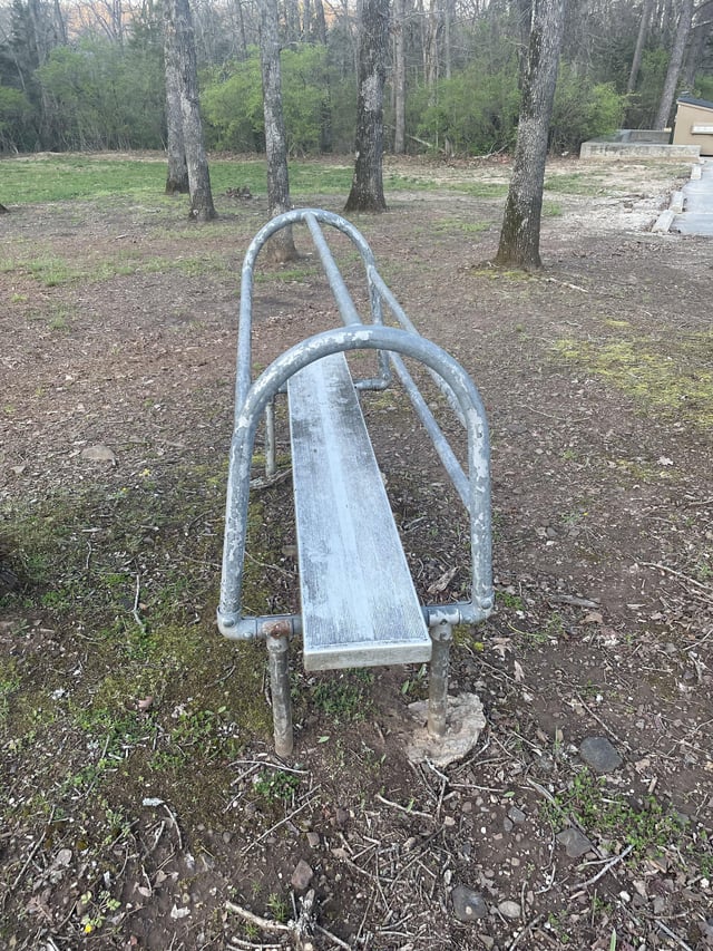 r/whatisthisthing - Strange “bench” with tubing near the parking lot of an old elementary school