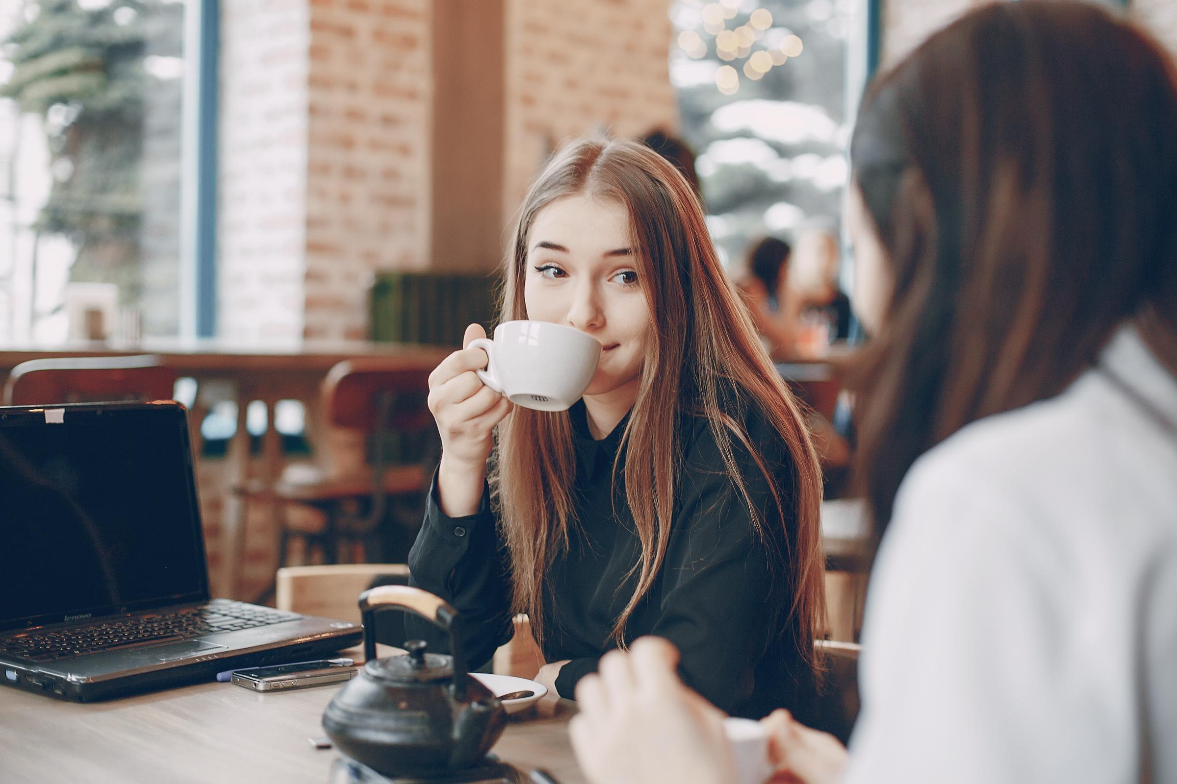 A woman drinking coffee | Source: Freepik