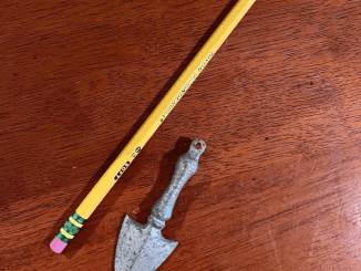 I found an old, finger-sized thing in an old house; does anyone know what it might be? Almost looks like a tiny shovel.