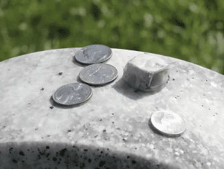 Meaning Behind the Tradition of Coins on Gravestones